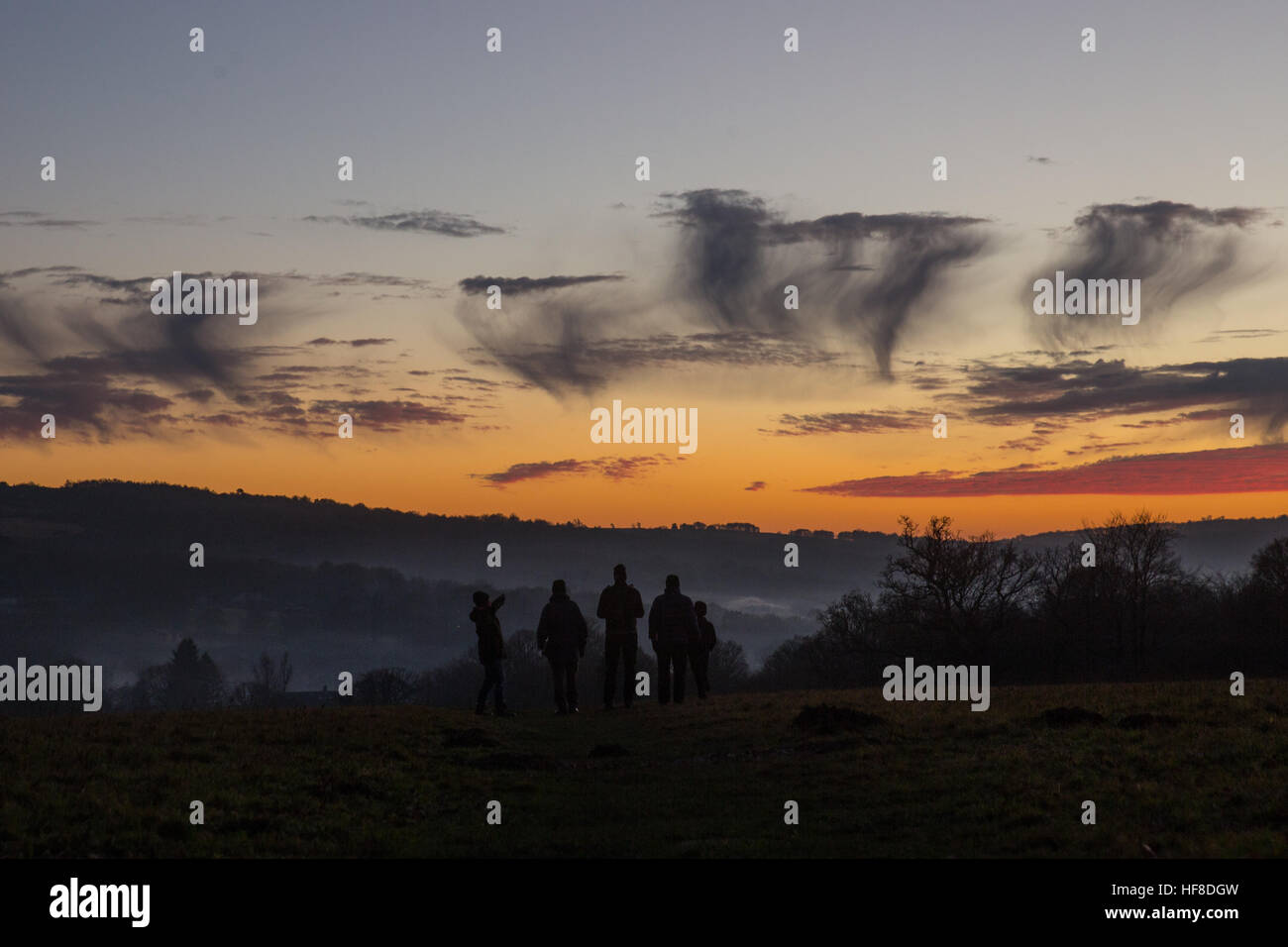 Sunset over the Ashdown Forest in Sussex, today 28th December 2016. The cold conditions brought on a show of clouds showing virga or 'fallstreaks' as ice or snow fell and evapourated as it hit a warmer layer of air. Credit: Chris Stevenson/Alamy Live News Stock Photo