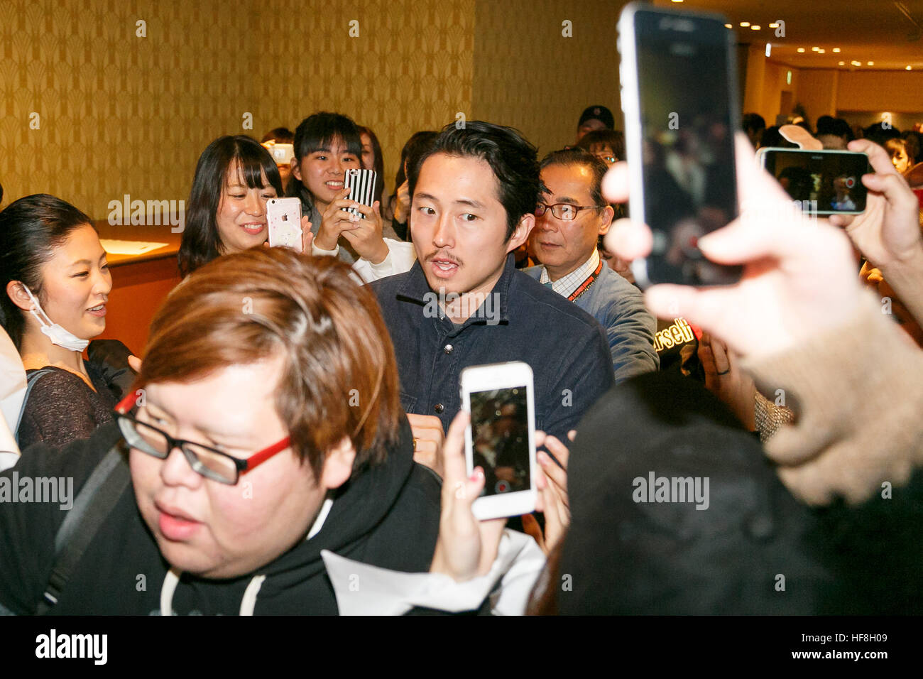 Actor Steven Yeun greets fans during the 11th Hollywood Collector's Convention at Shinagawa Prince Hotel on December 29, 2016, Tokyo, Japan. Four of the cast members for the popular TV series The Walking Dead visited Japan to promote the show and spend time with the fans during the 2-day event which started today. © Rodrigo Reyes Marin/AFLO/Alamy Live News Stock Photo