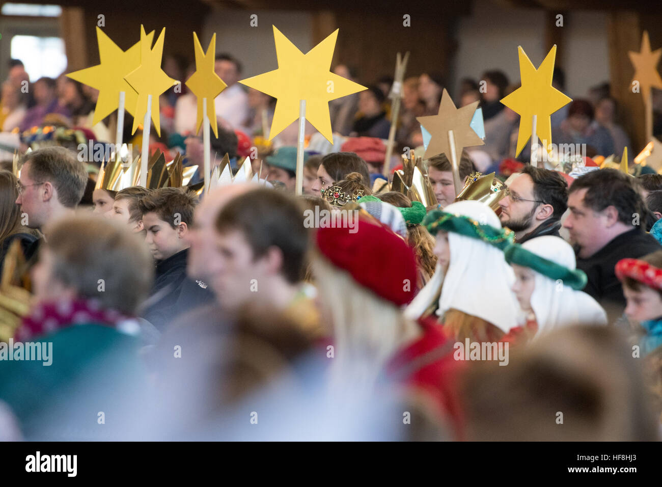 Star singers (also known as epiphany singers) take part in the opening ceremony of the nationwide German star singing action in Neumarkt in der Oberpfalz, Germany, 29 December 2016. Star singers travel from house to house and ask for donations to charitable causes across the world every 6th January. Photo: Armin Weigel/dpa Stock Photo
