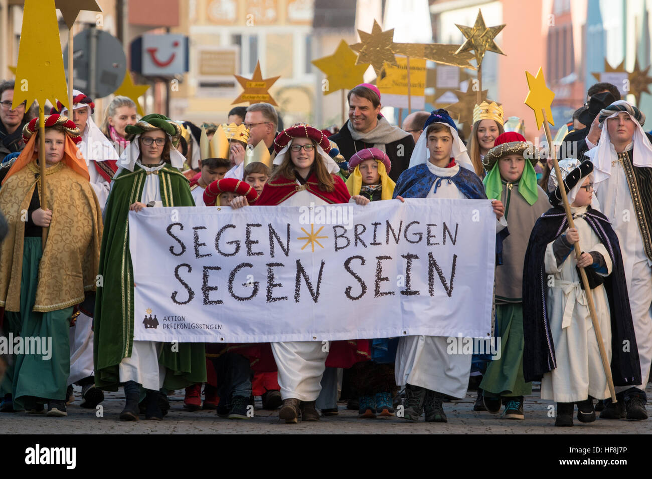 Star singers (also known as epiphany singers) take part in the opening ceremony of the nationwide German star singing event in Neumarkt in der Oberpfalz, Germany, 29 December 2016. Star singers travel from house to house and ask for donations to charitable causes across the world every 6th January. Photo: Armin Weigel/dpa Stock Photo