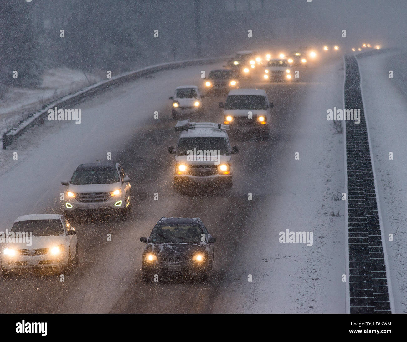 Westminster, Massachusetts, USA. 29 December, 2016. A winter storm projected to bring about a foot of snow to north central Massachusetts impacts the afternoon commute along Rt 2 in Westminster, Mass. Many motor vehicle crashes were reported throughout the region. Oncoming traffic is headed westbound.   © Jim Marabello/ Alamy Live News Stock Photo