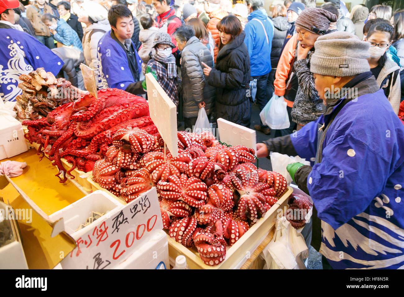 People shop along the street of Ameyoko district near Ueno station on December 30, 2016, Tokyo, Japan. Ameya Yokocho (Ameyoko) is a narrow shopping street with more than 500 retailers where year-end shoppers gather to buy traditional food for the New Year celebration (called osechi-ryori). © Rodrigo Reyes Marin/AFLO/Alamy Live News Stock Photo