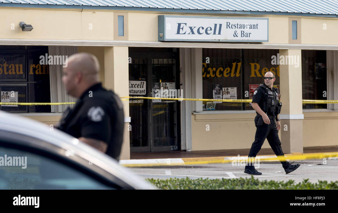 West Palm Beach, Florida, USA. 30th Dec, 2016. Delray Beach police investigate a shooting outside Excell Restaurant & Bar in Delray Beach, FL on December 29, 2016. A 23-year-old man was killed early Thursday after an argument turned into a fatal shooting the bar according to city police. Niherson Gustave was shot at 1041 South Congress Ave. after 2 a.m. Thursday. Witnesses told police Gustave and friends were arguing with another group inside the club and then they were all ejected. The other group shot Gustave in the parking lot of the club. (Credit Image: © Allen Eyestone/The Palm Beac Stock Photo