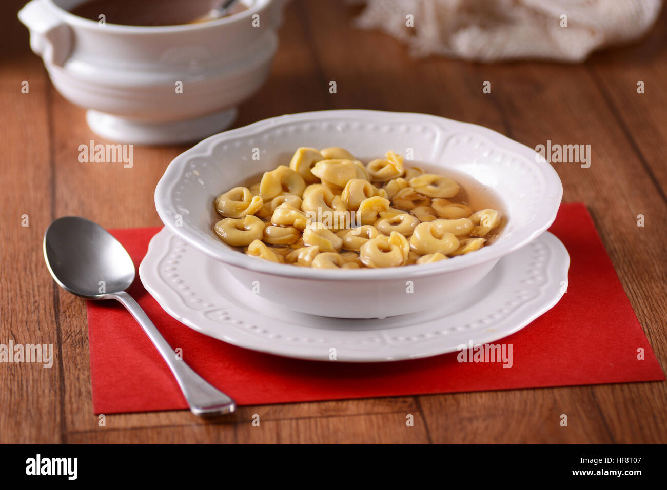 tortellini in broth - traditional Italian food Stock Photo