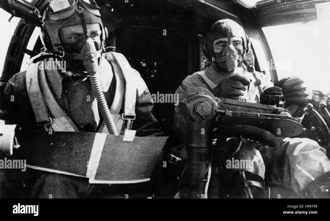 The Nazi propaganda image shows the crew of a combat plane wearing oxygen masks on a sortie. Published in June 1940. A Nazi reporter writes on the reverse of the picture, 'At great heights against the enemy. To protect themselves against the thin air, the pilots are equipped with an oxygen supply apparatus, so that they can reach enemy targets from a great height and, as the Oberkommando of the Wehrmacht reports, bombarding with great effect.' Fotoarchiv für Zeitgeschichte - NO WIRELESS SERVICE - | usage worldwide Stock Photo