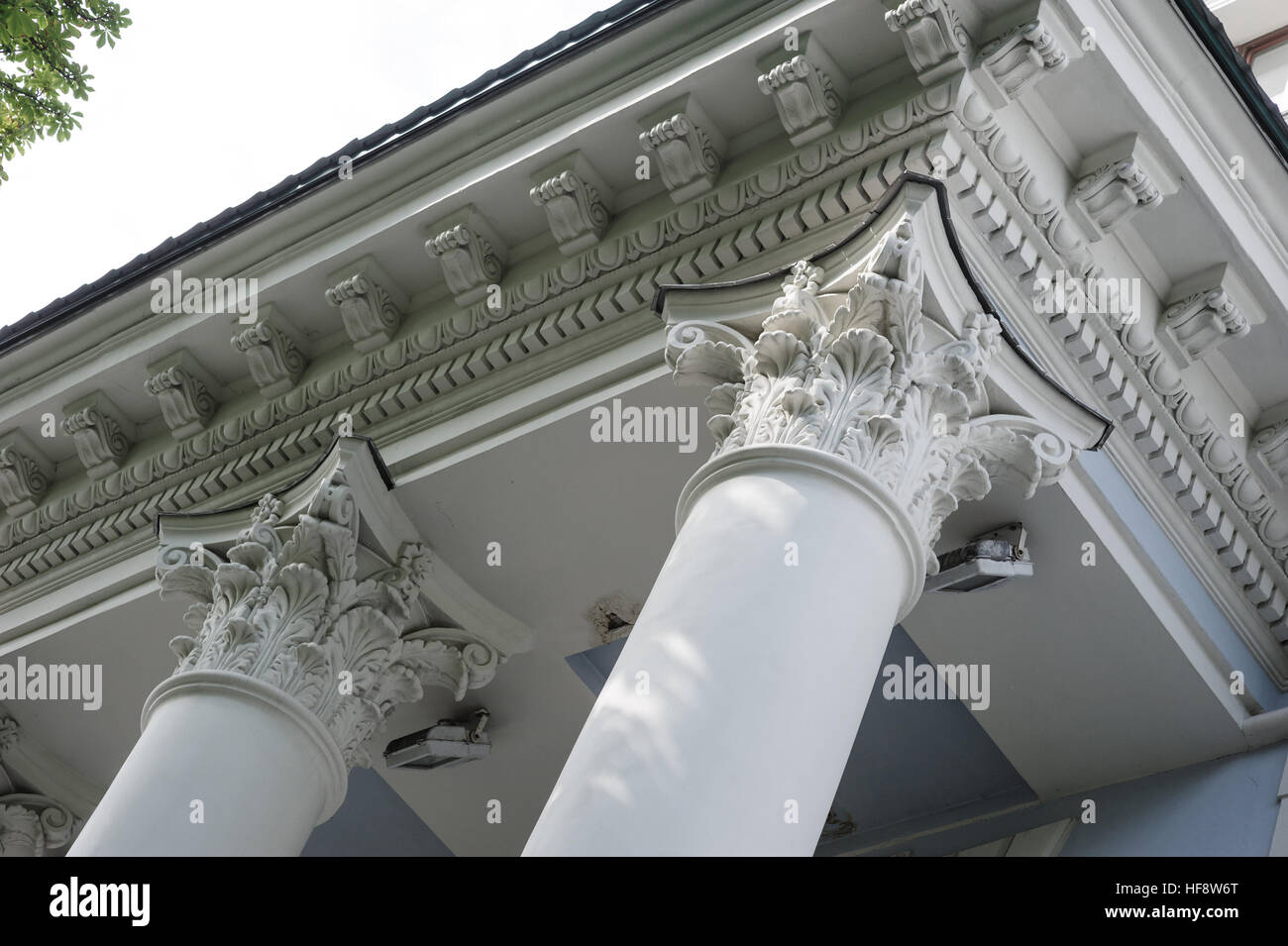 Capital gray closeup Corinthian columns on a building facade Stock Photo