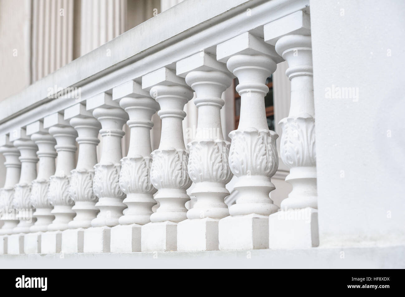 White balustrade on the restored facade of the building Stock Photo