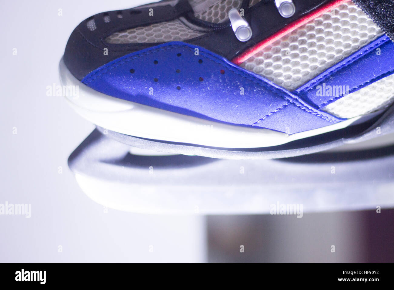 Ice skates in skate store shop window on display on sale for skating on