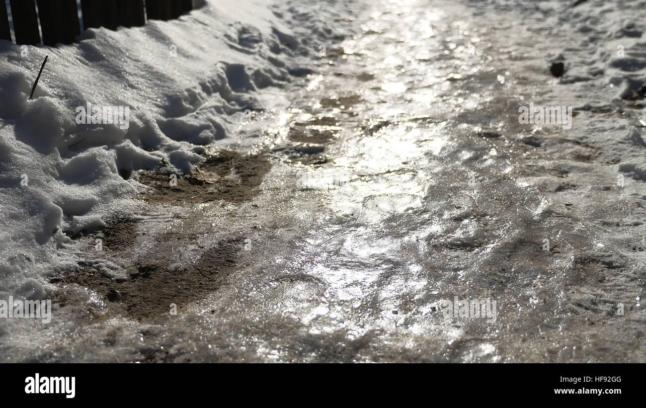 footpath in the city winter frozen of ice and snow is slippery Stock ...