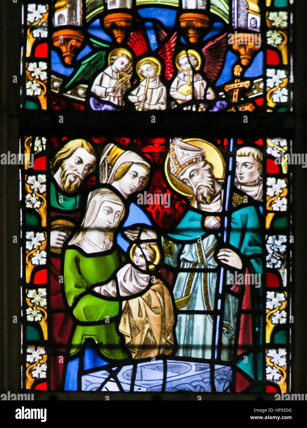 Stained Glass window depicting a Baptism in the Cathedral of Saint Bavo in Ghent, Flanders, Belgium. Stock Photo