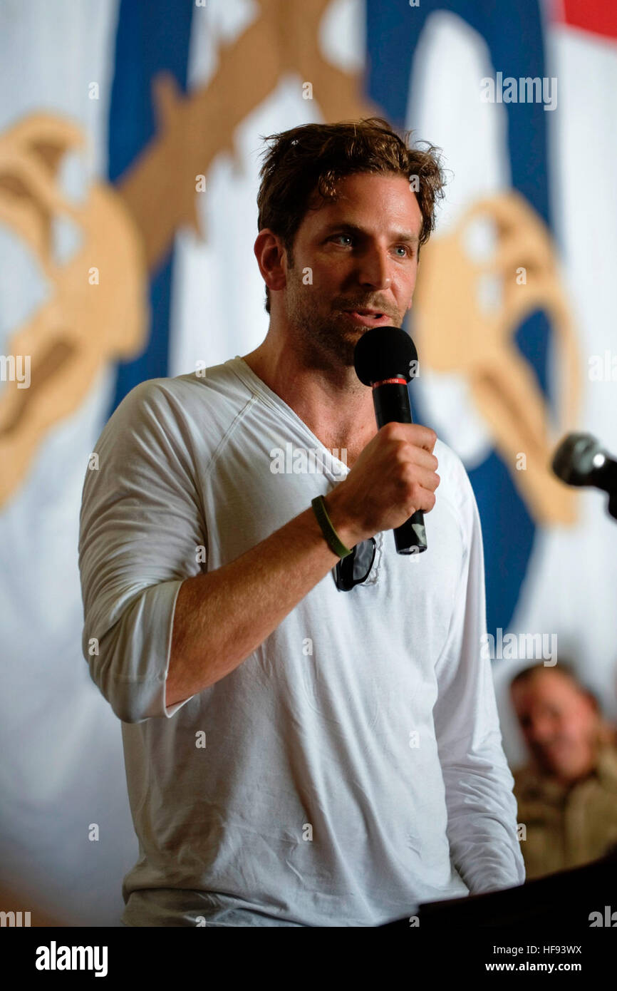 Actor Bradley Cooper addresses the crew aboard aircraft carrier USS Ronald Reagan (CVN 76), under way in the Gulf of Oman, July 13, 2009, during a United Service Organizations tour to the U.S. Central Command area of operations. The tour also features National Football League (NFL) hall of fame coach Don Shula, all-pro NFL running back Warrick Dunn, actor D.B. Sweeney and sports announcer and model Leeann Sweeden. (DoD photo by Mass Communication Specialist 1st Class Chad J. McNeeley, U.S. Navy/Released) Bradley Cooper, July 2009 Stock Photo