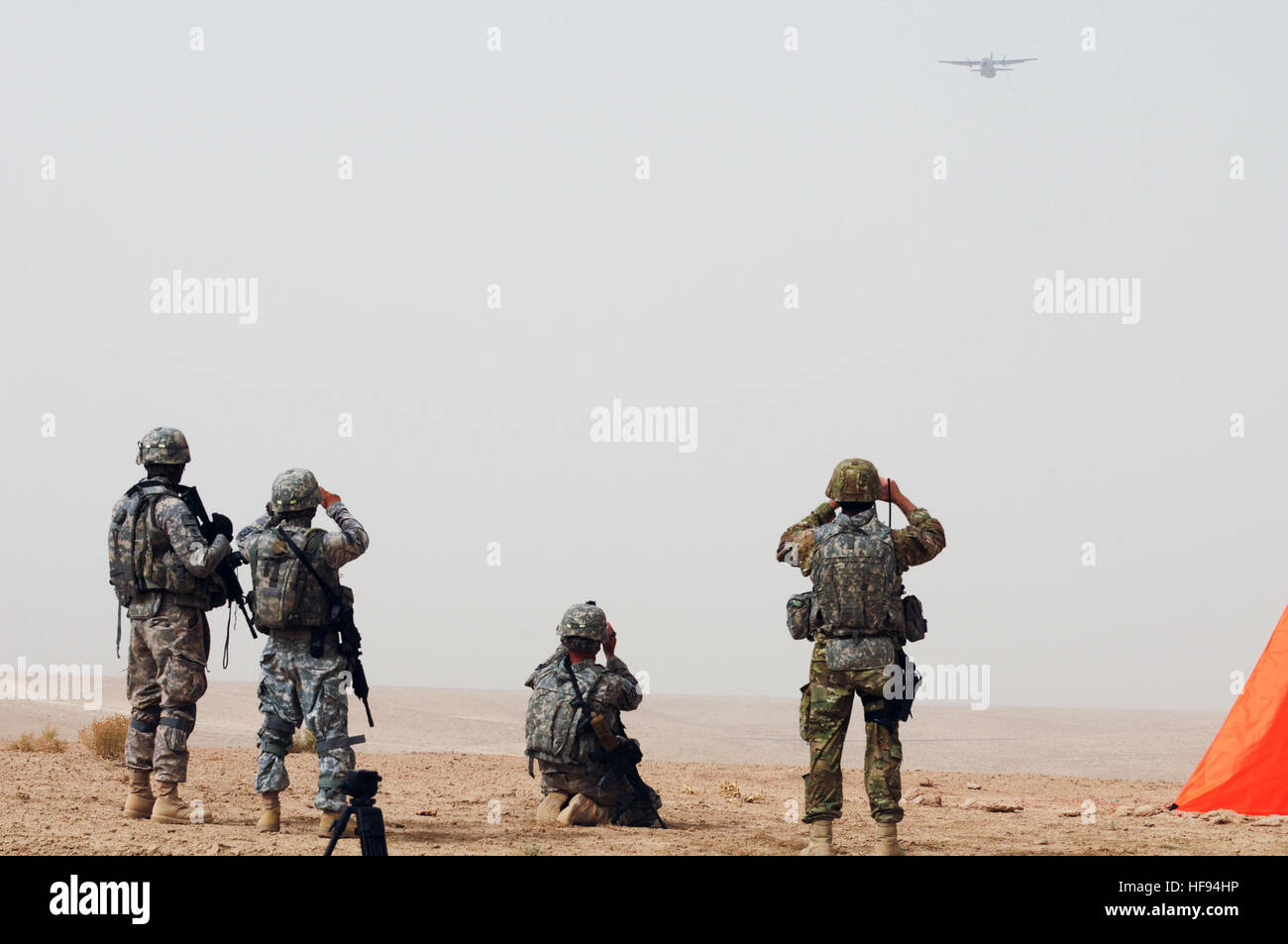 Ground security and recovery teams observe a C-27 Spartan transport ...
