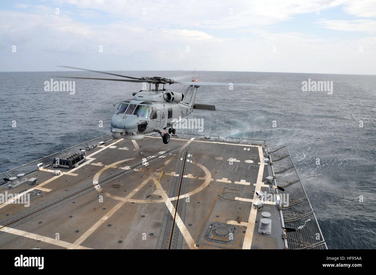 A Republic of Singapore S-70B helicopter lands aboard the guided ...