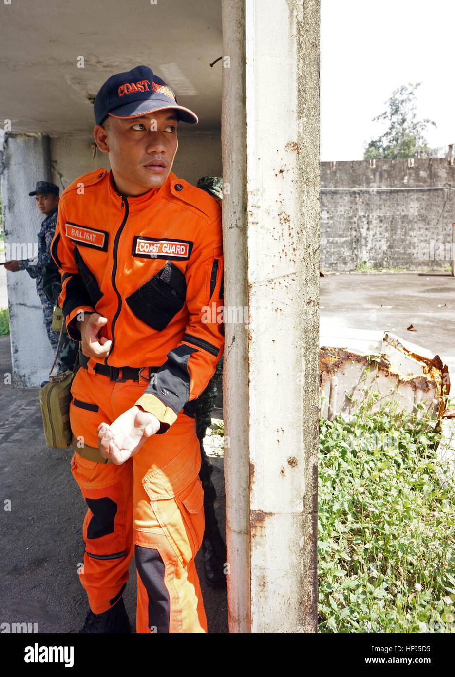 A sailor with the Philippine Coast Guard Medical Corps prepares to