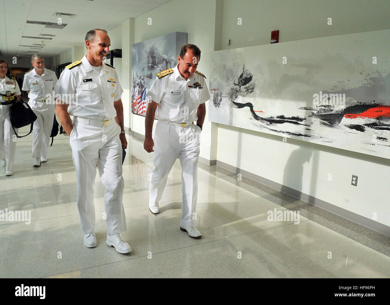 130606-N-ZI511-237.WASHINGTON (June 6, 2013) Chief of Naval Operations (CNO) Adm. Jonathan Greenert meets with First Sea Lord Adm. Sir George Zambellas during United States and United Kingdom staff talks at National Defense University. Greenert and Zambellas along with 30 other U.S. Navy and Royal Navy officers met to discuss issues of mutual concern and the maritime challenges both nations face in the future. (U.S. Navy photo by Chief Mass Communication Specialist Julianne Metzger/Released). Chief of U.S. Naval Operations Adm. Jonathan Greenert, front left, walks with British Royal Navy First Stock Photo