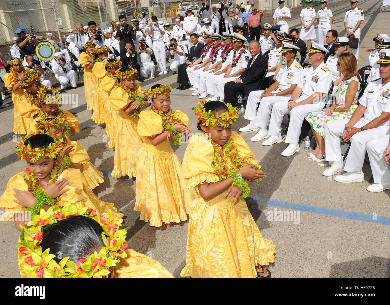 130906-N-ZK021-008 – PEARL HARBOR-HICKAM (Sept. 6, 2013) – U.S. and Chinese leaders watch as Keiki Hula dancers perform during an arrival ceremony for three People’s Liberation Army-Navy ships, Luhu-class destroyer Qingdao (DDG 113), Jiangkai-class frigate Linyi (FFG 547) and a Fuqing-class fleet oiler as they arrive in Hawaii for a scheduled port visit. Over the weekend, Chinese and U.S. leaders will conduct dialogues to build confidence and mutual understanding between the two nations. The port visit is part of the U.S. Navy’s ongoing effort to maximize opportunities for developing relations Stock Photo