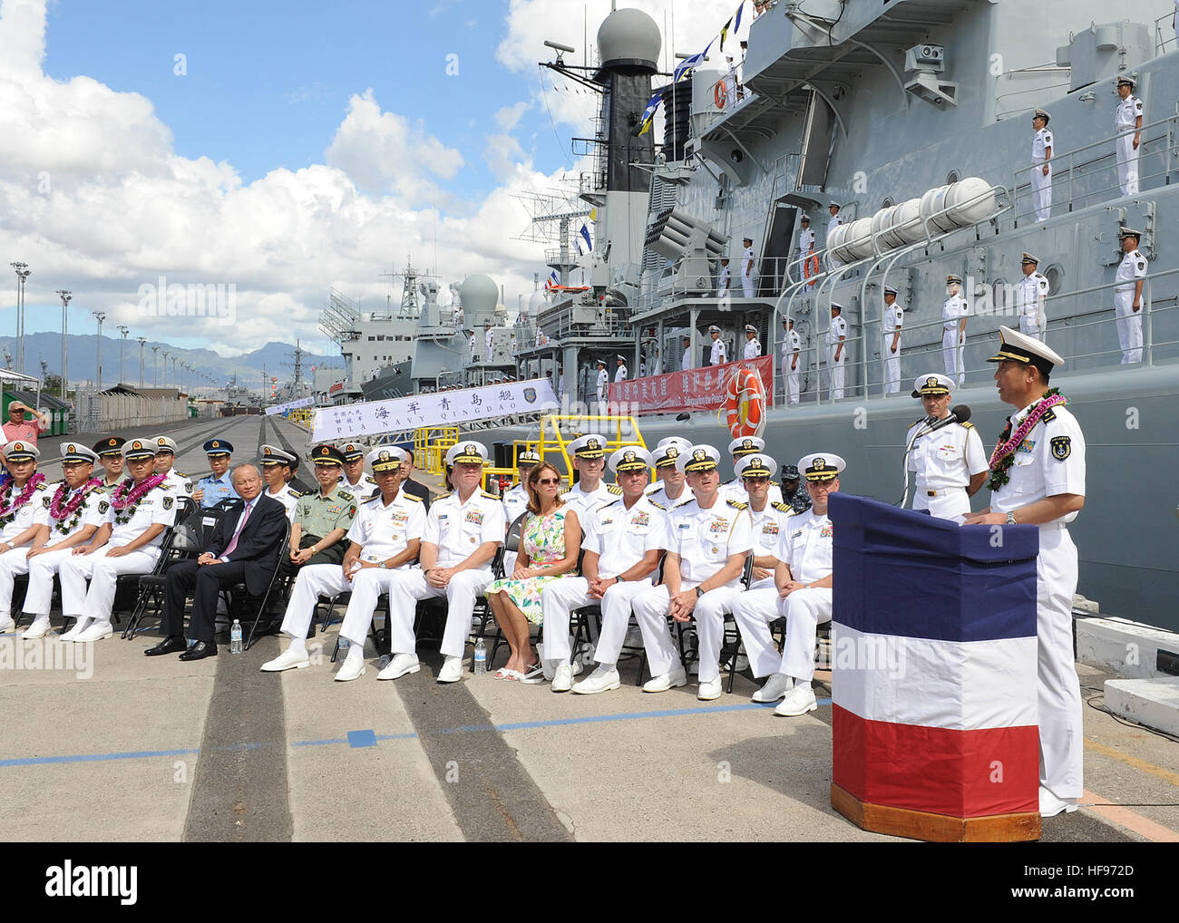 130906-N-ZK021-012 – PEARL HARBOR-HICKAM (Sept. 6, 2013) – Rear Adm. Wei Gang, Chief of Staff, North Sea Fleet (Head of Delegation) gives remarks during an arrival ceremony for three People’s Liberation Army-Navy ships Luhu-class destroyer Qingdao (DDG 113), Jiangkai-class frigate Linyi (FFG 547) and a Fuqing-class fleet oiler as they arrive in Hawaii for a scheduled port visit. Over the weekend, Chinese and U.S. leaders will conduct dialogues to build confidence and mutual understanding between the two nations. The port visit is part of the U.S. Navy’s ongoing effort to maximize opportunities Stock Photo