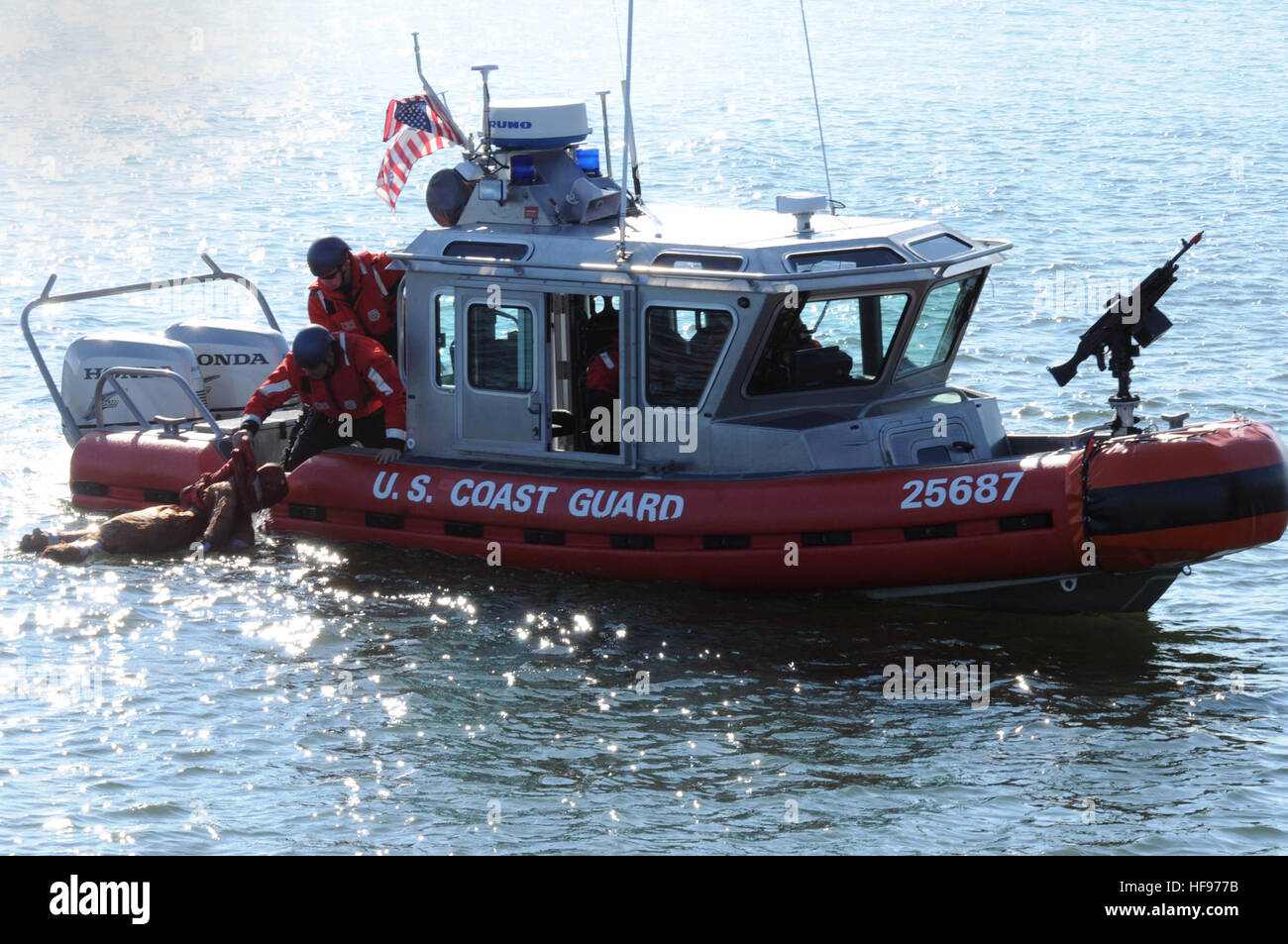 Coast Guardsmen retrieve a manoverboard dummy during Operation Citadel Shield at Joint