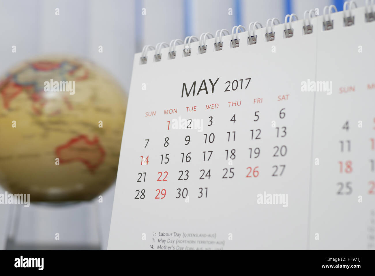 Close up calendar of May 2017 with blur earth globe background Stock Photo