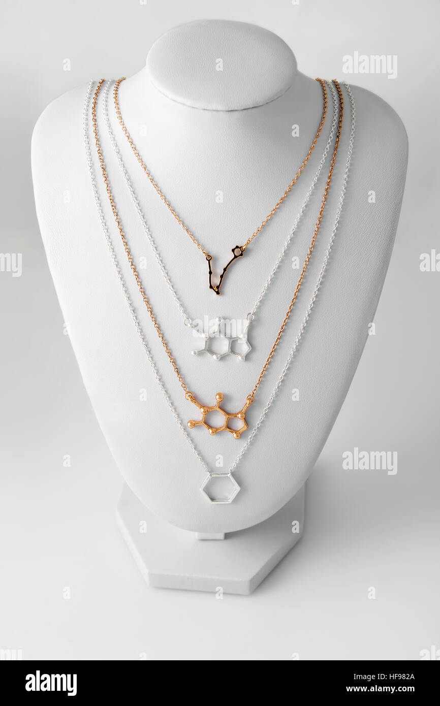Necklaces in shape of molelule and constellation Pisces made of gold ...