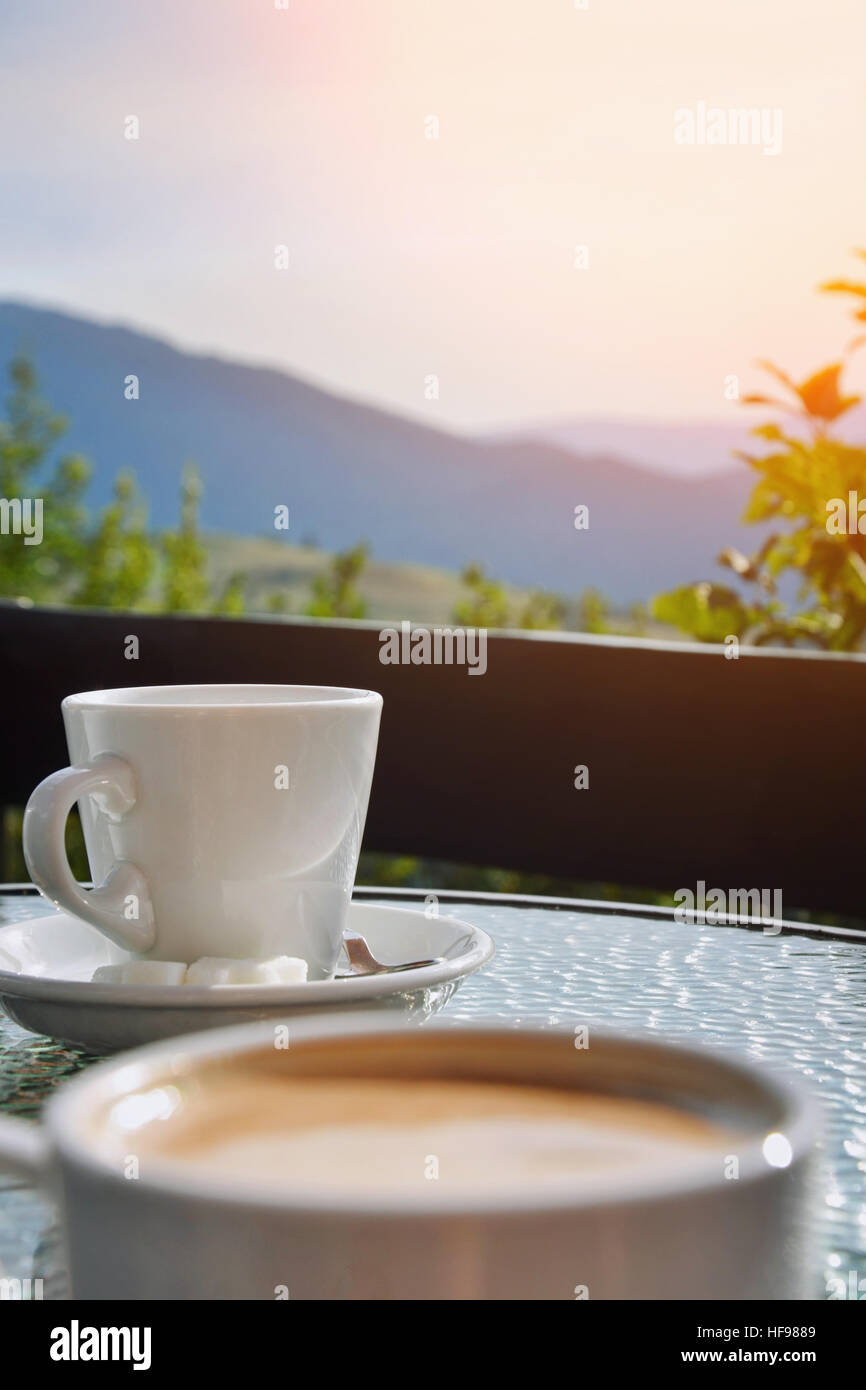 Coffee cup on a background of mountains. Breakfast in nature Stock Photo -  Alamy