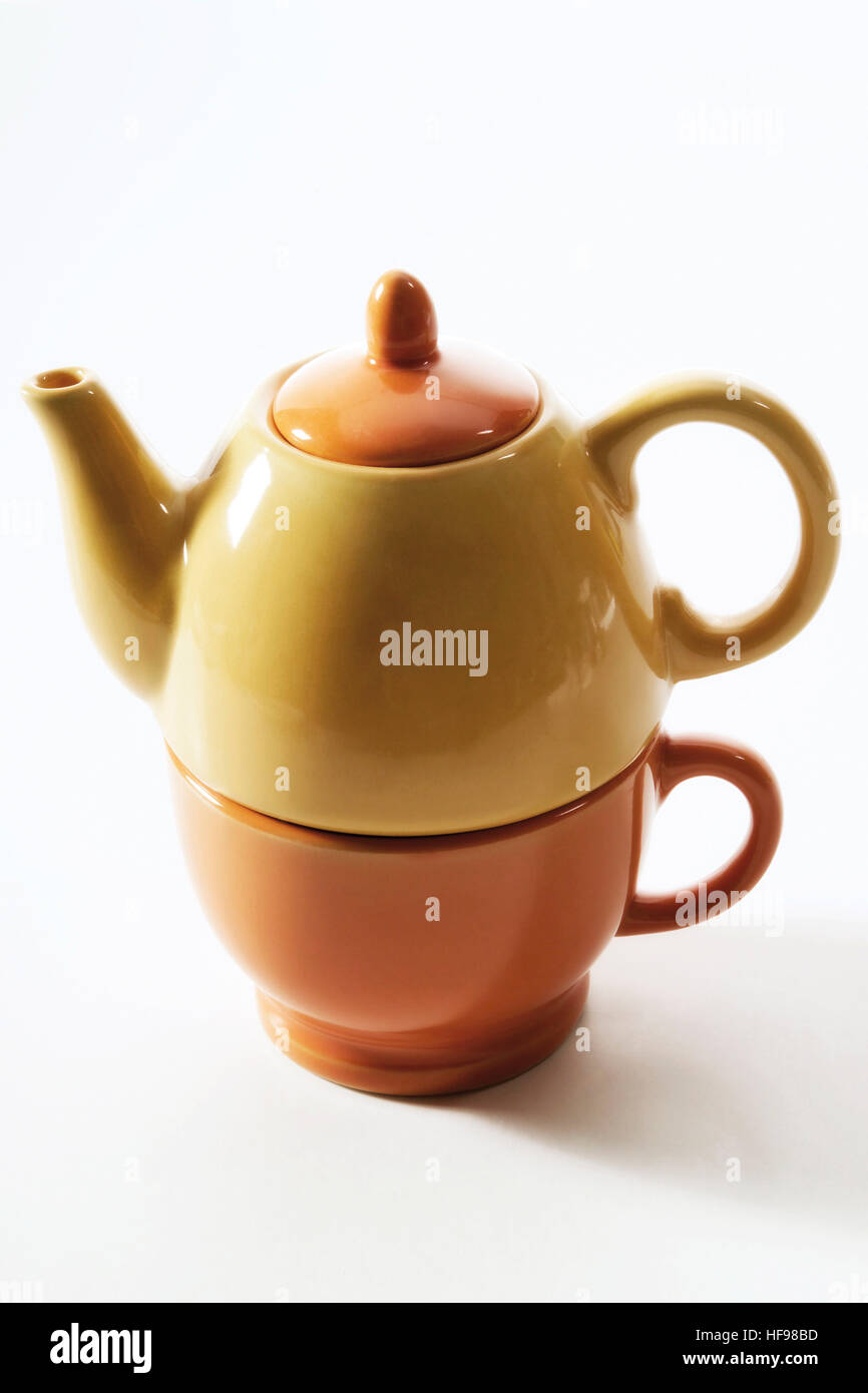 Tea for one small teacup and teapot, stacked Stock Photo Alamy
