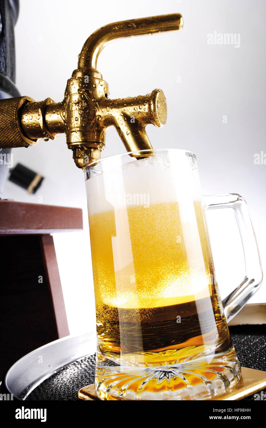 Freshly tapped glass of lager Stock Photo