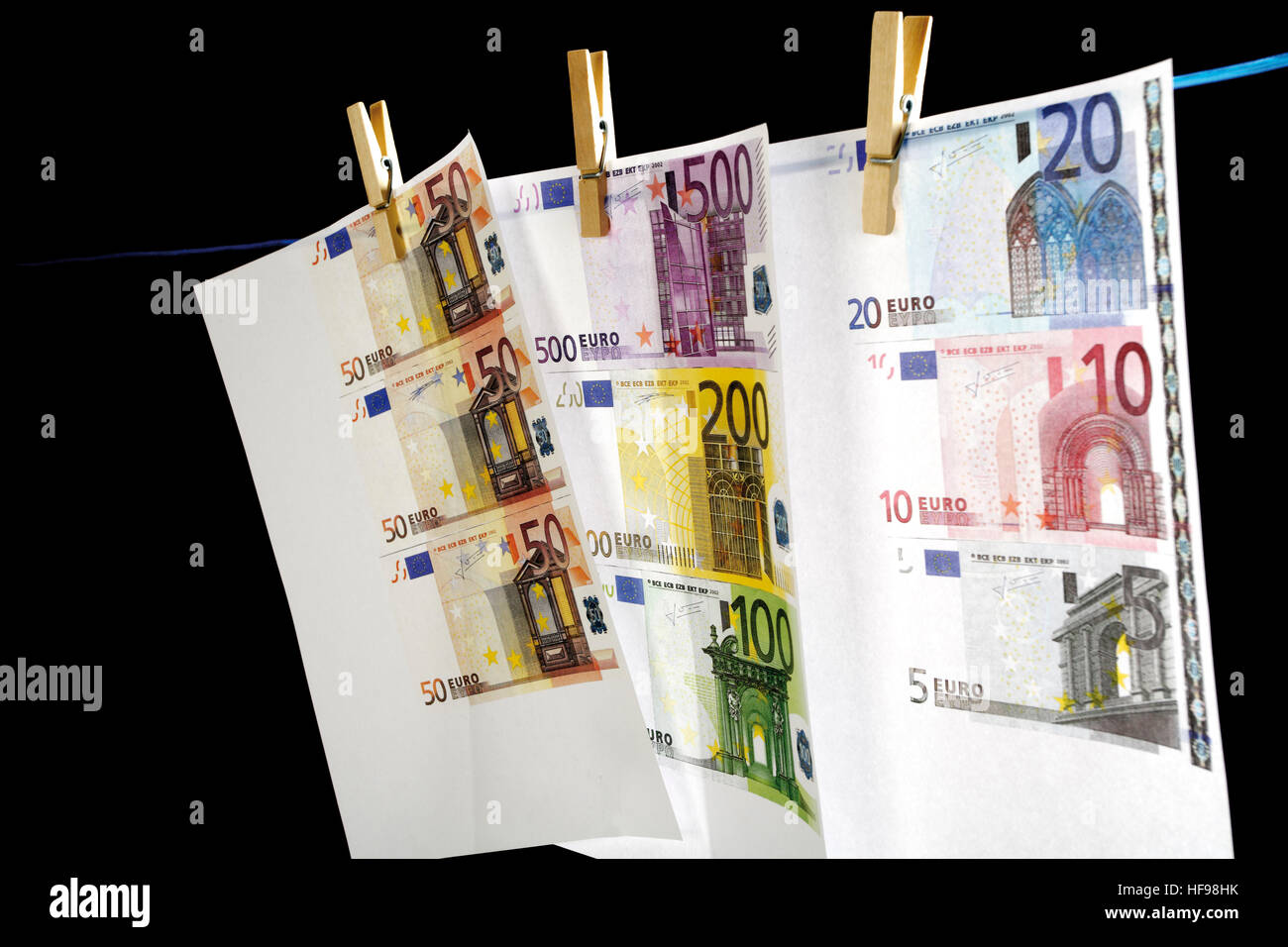 Counterfeit money hanging on a clothesline, money laundering Stock