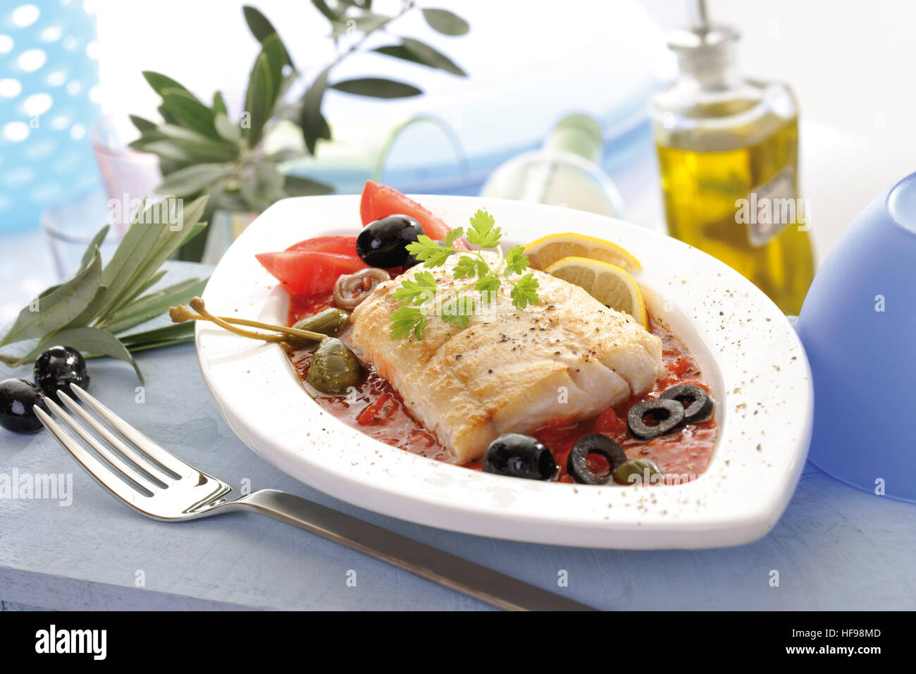 Mediterranean seafood dish fried Victoria Sea Bass with tomato sauce