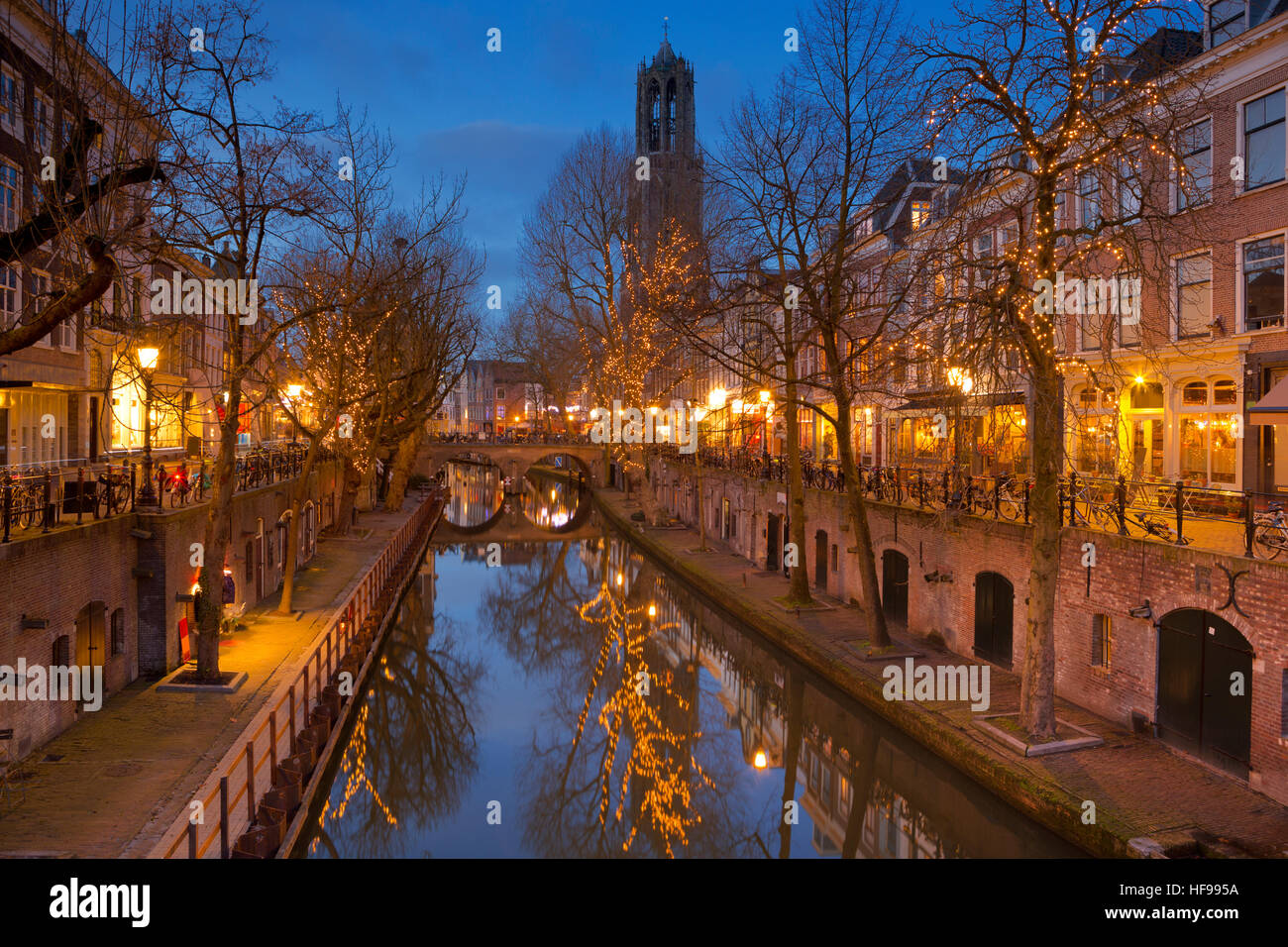 The Oudegracht canal and Dom church in Utrecht in The Netherlands at night. Stock Photo