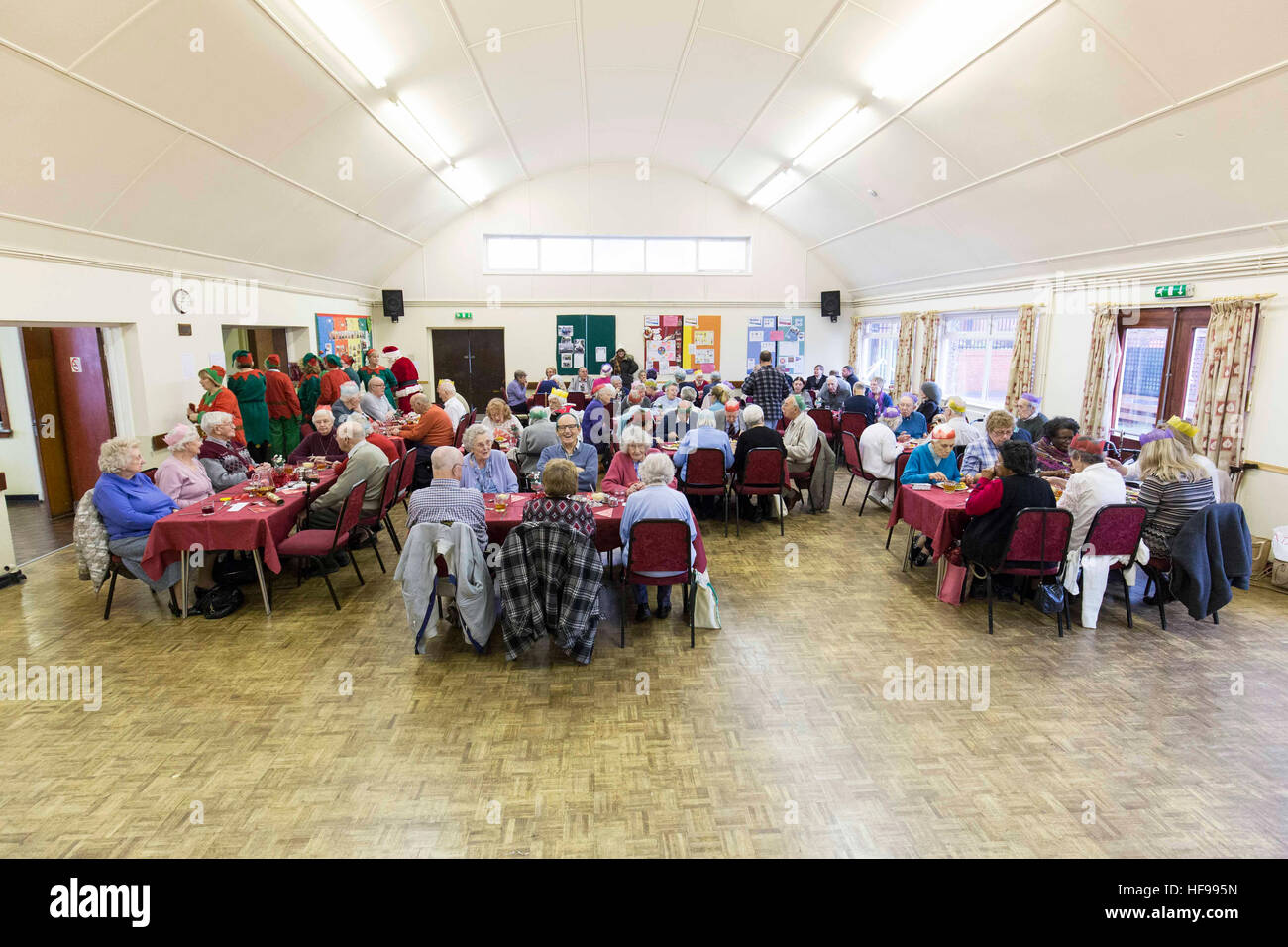 Old people enjoy a Christmas party at Holy Trinity Church Hall , Southport Stock Photo