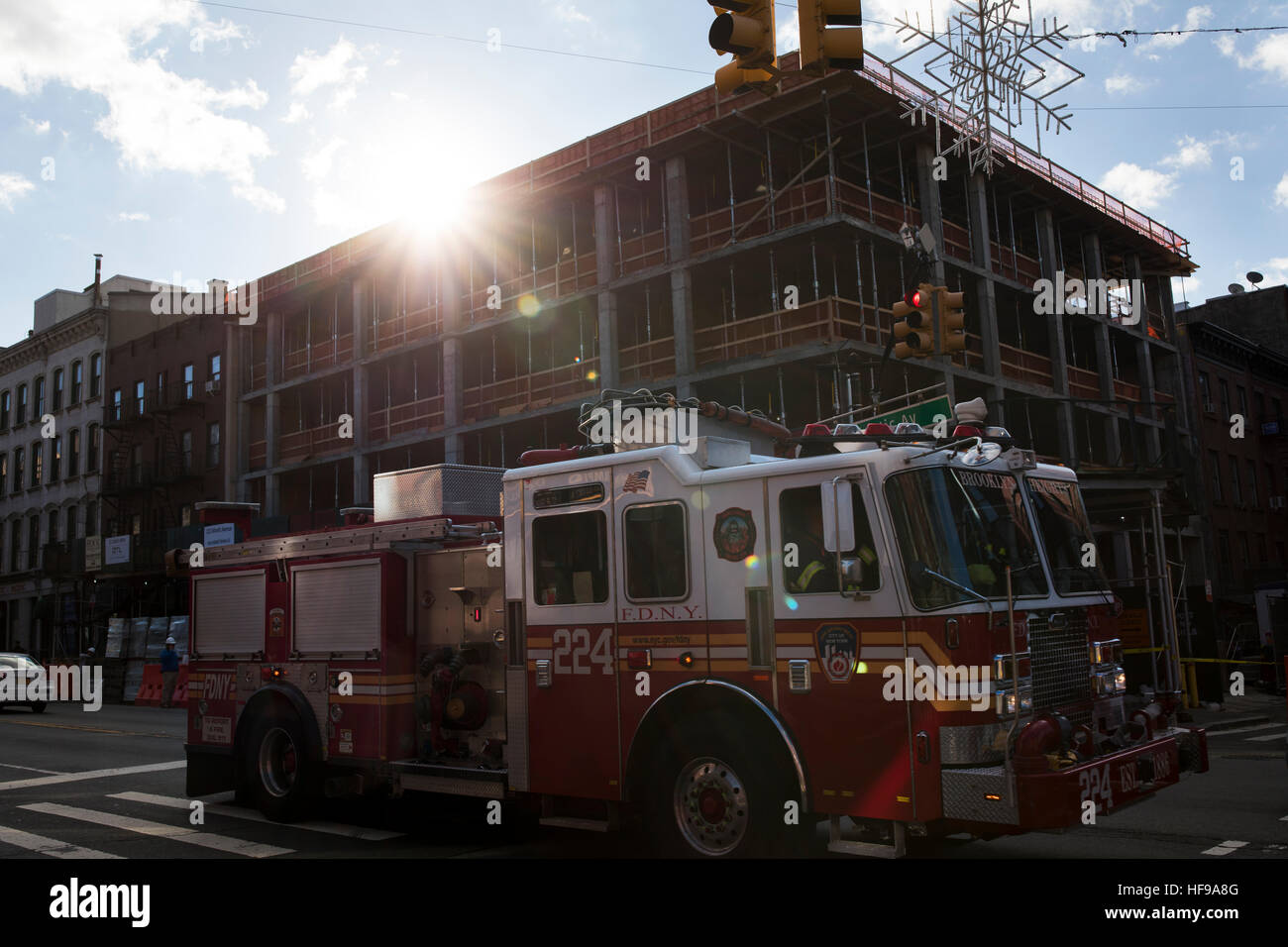 A New York Fire Department truck drives by a newly constructed ...