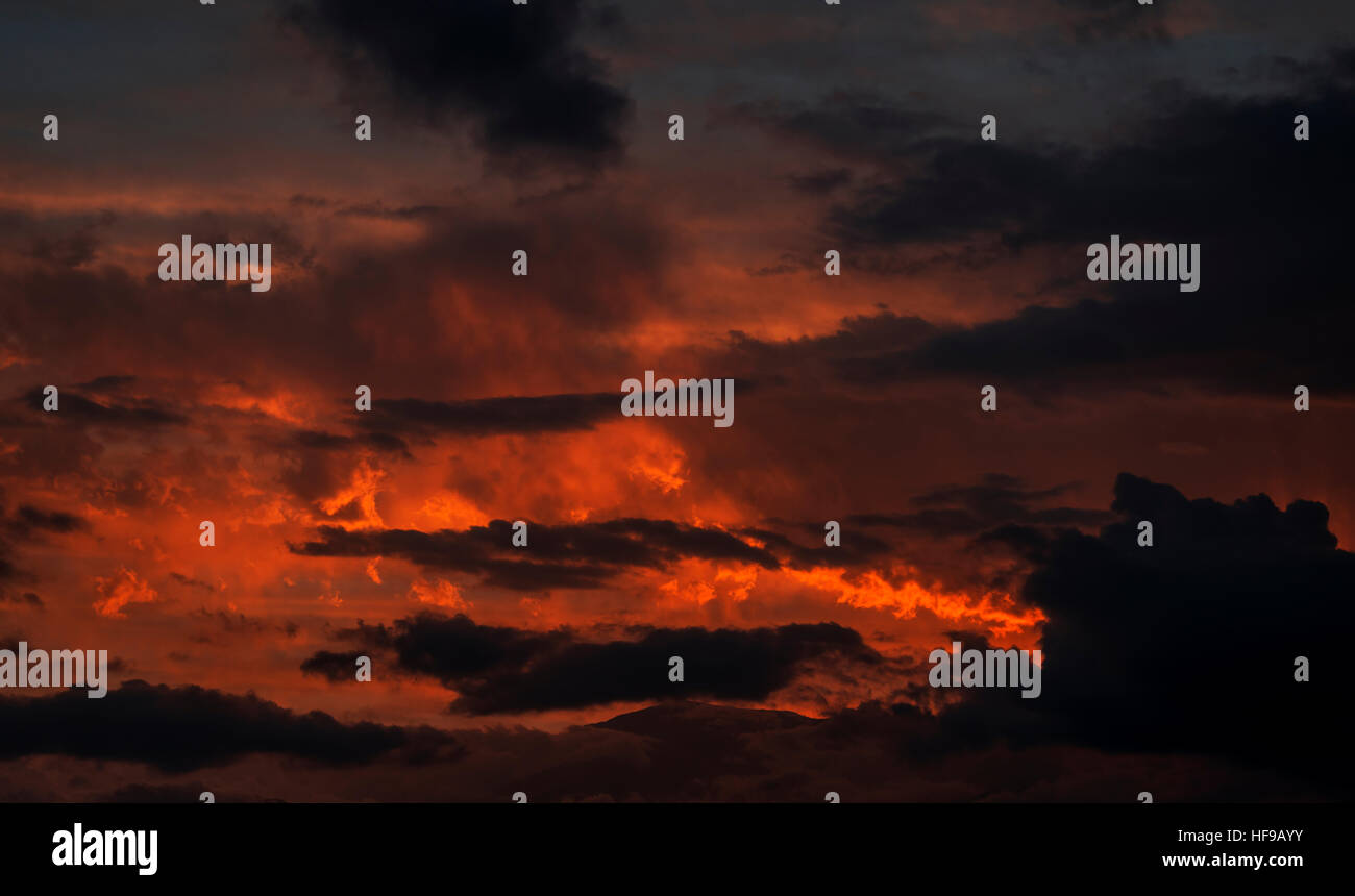 Sunset with orange and yellow clouds in the sky Stock Photo - Alamy