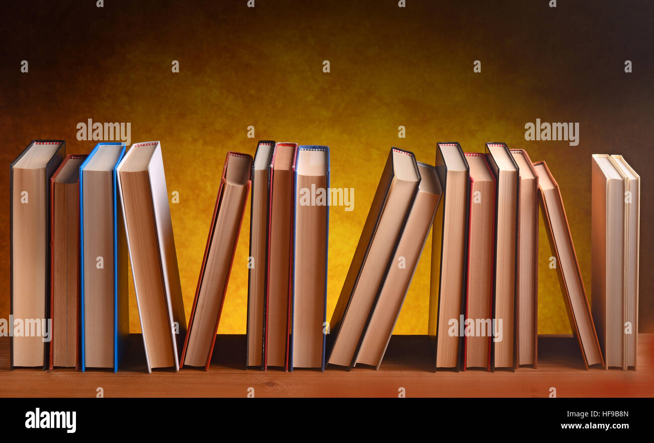 pile of books on the wooden table Stock Photo - Alamy