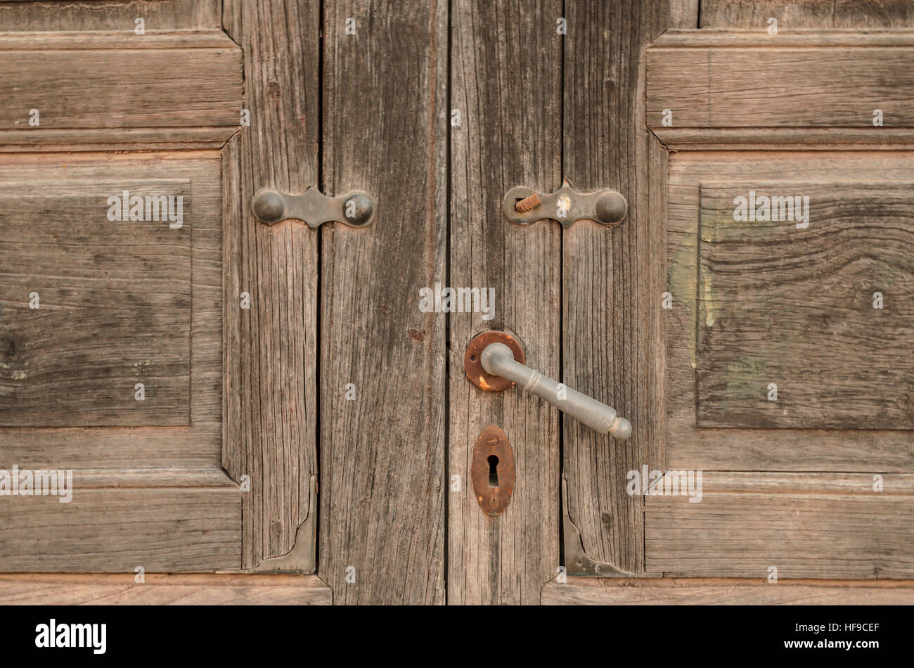 Detail of old wooden door with lock and latch Stock Photo - Alamy