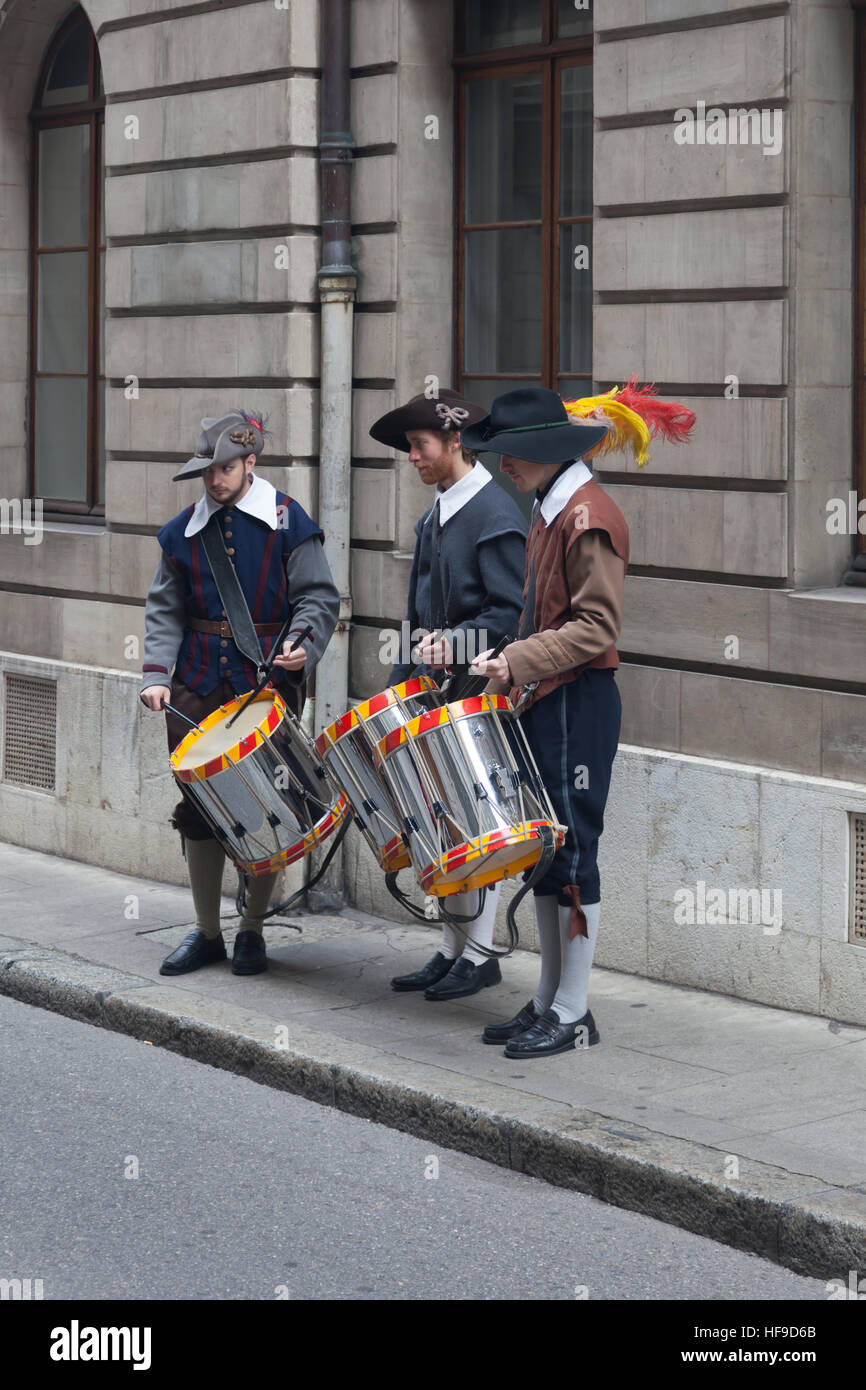 Three young drummers in period costume celebrating Escalade in Geneva Stock Photo