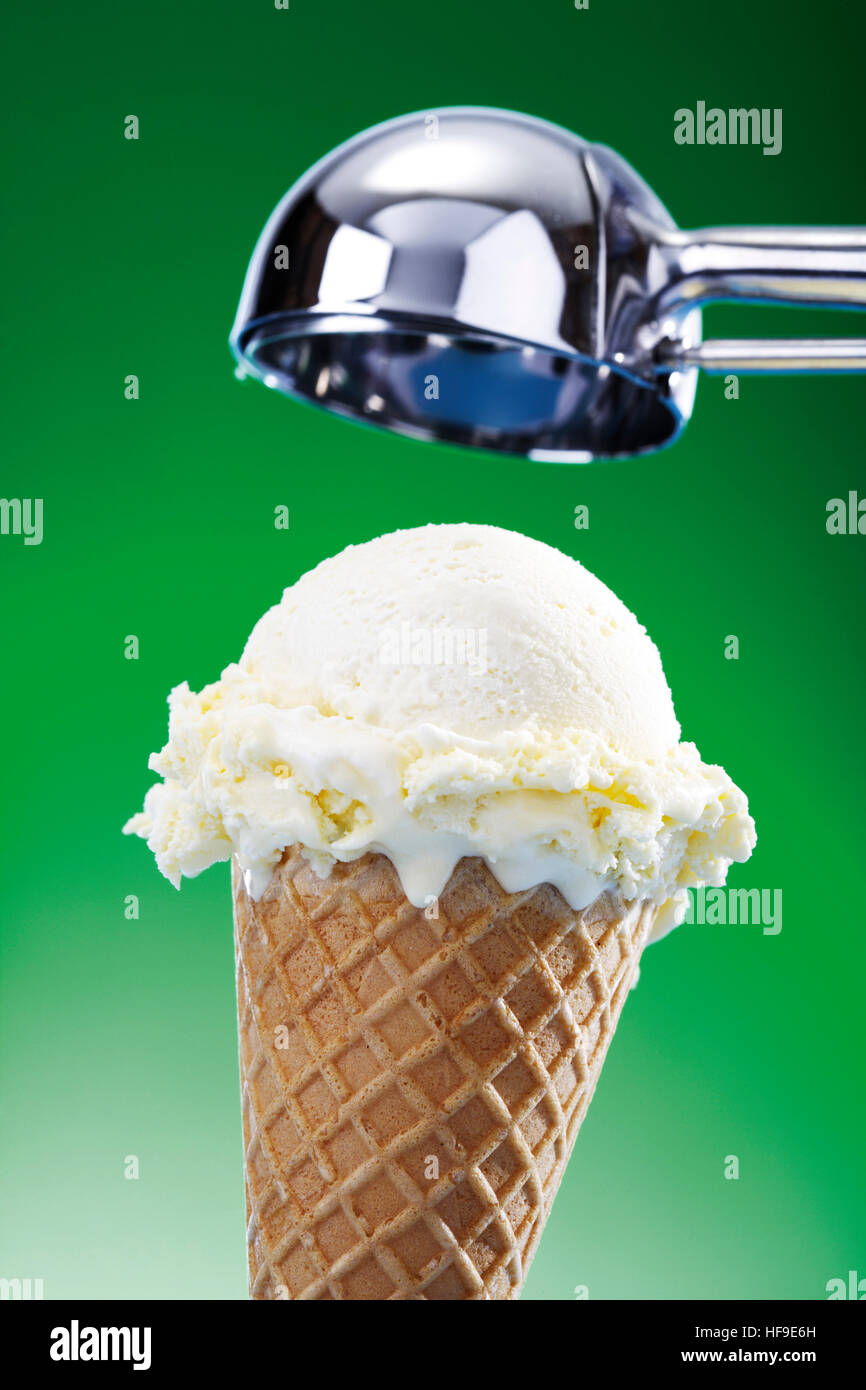 Scoop of vanilla ice cream in a waffle cone, ice cream scoop Stock ...