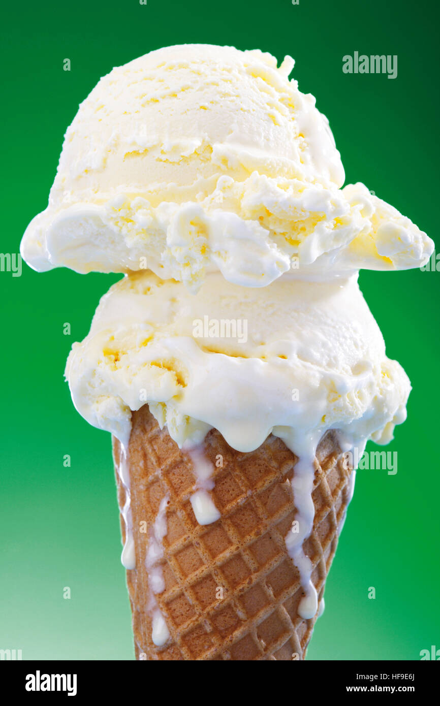 Two scoops of vanilla ice cream in a waffle cone Stock ...