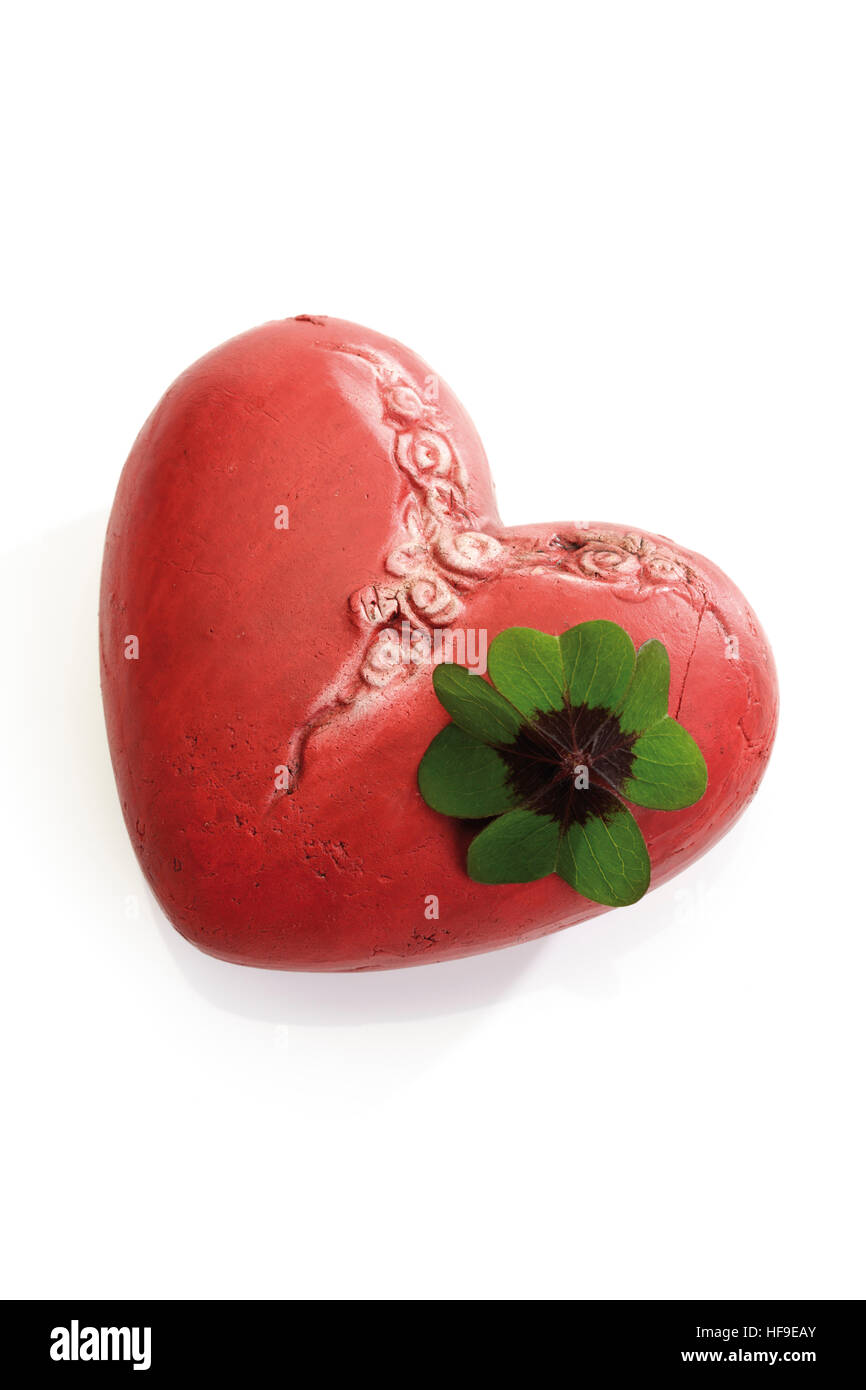 Red heart and a four-leaf clover Stock Photo