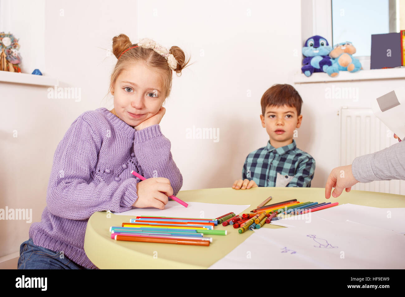 Disobedient girl doesn't want to do an assignment in drawing class Stock  Photo - Alamy