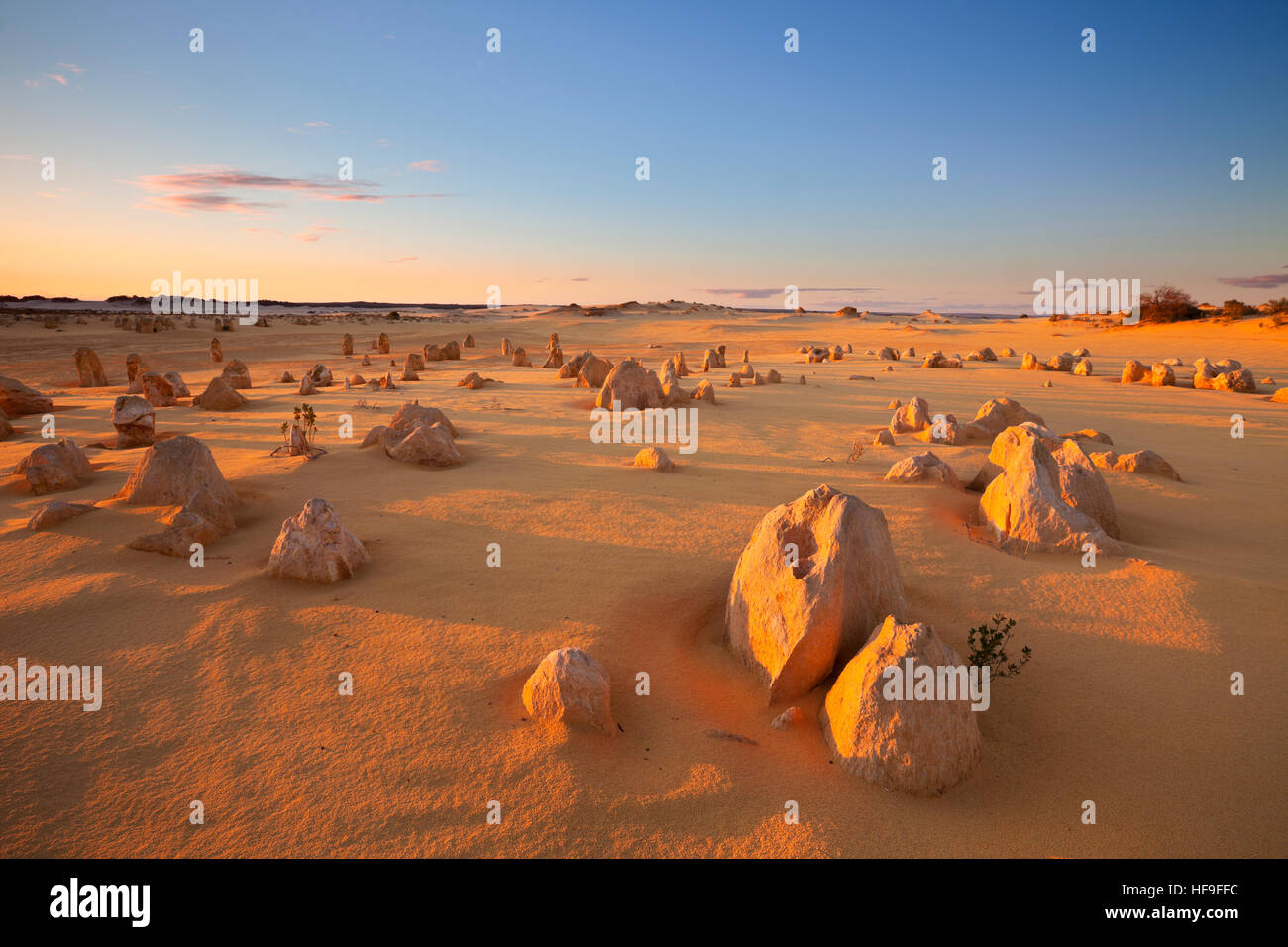 The Pinnacles Desert in the Nambung National Park, Western Australia. In the light of a setting sun. Stock Photo