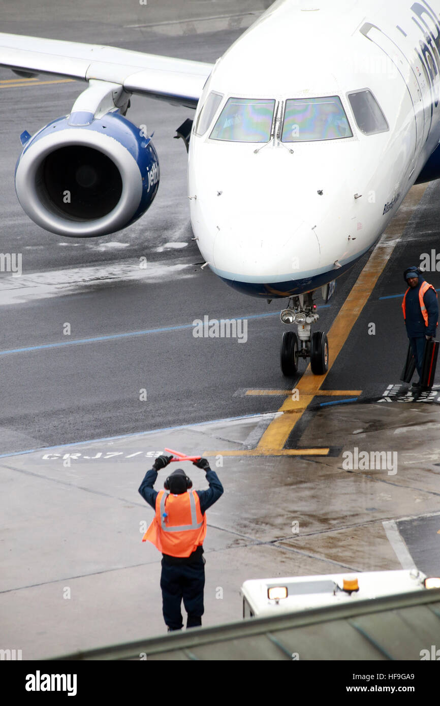 Aircraft marshaller at Westchester County Airport, Harrison, NY, USA Stock Photo