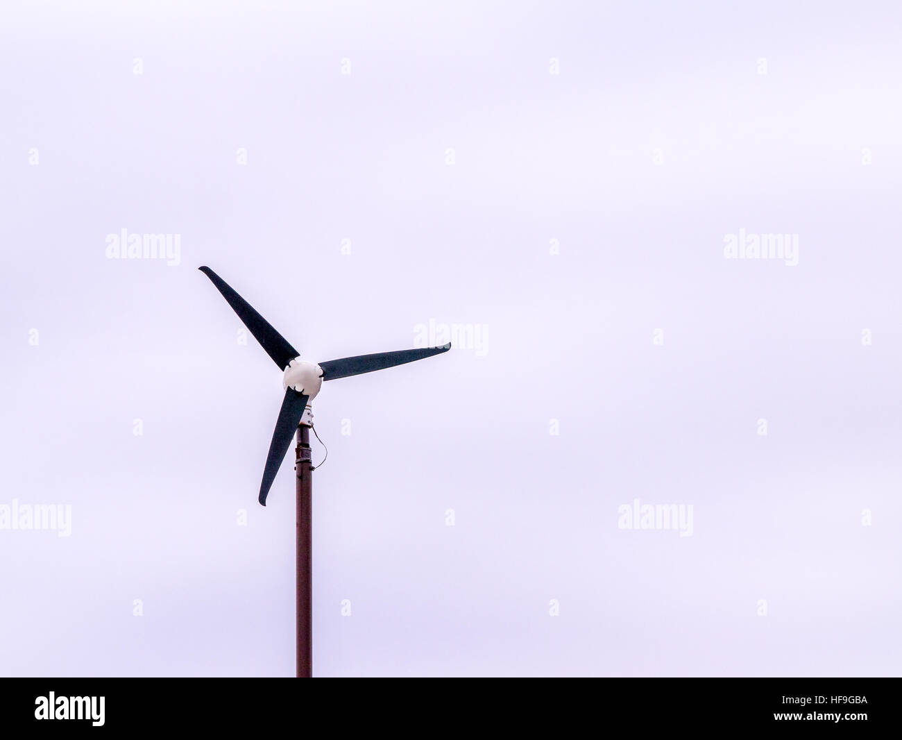 Isolated three blade wind turbine, minimalist, copy space Stock Photo