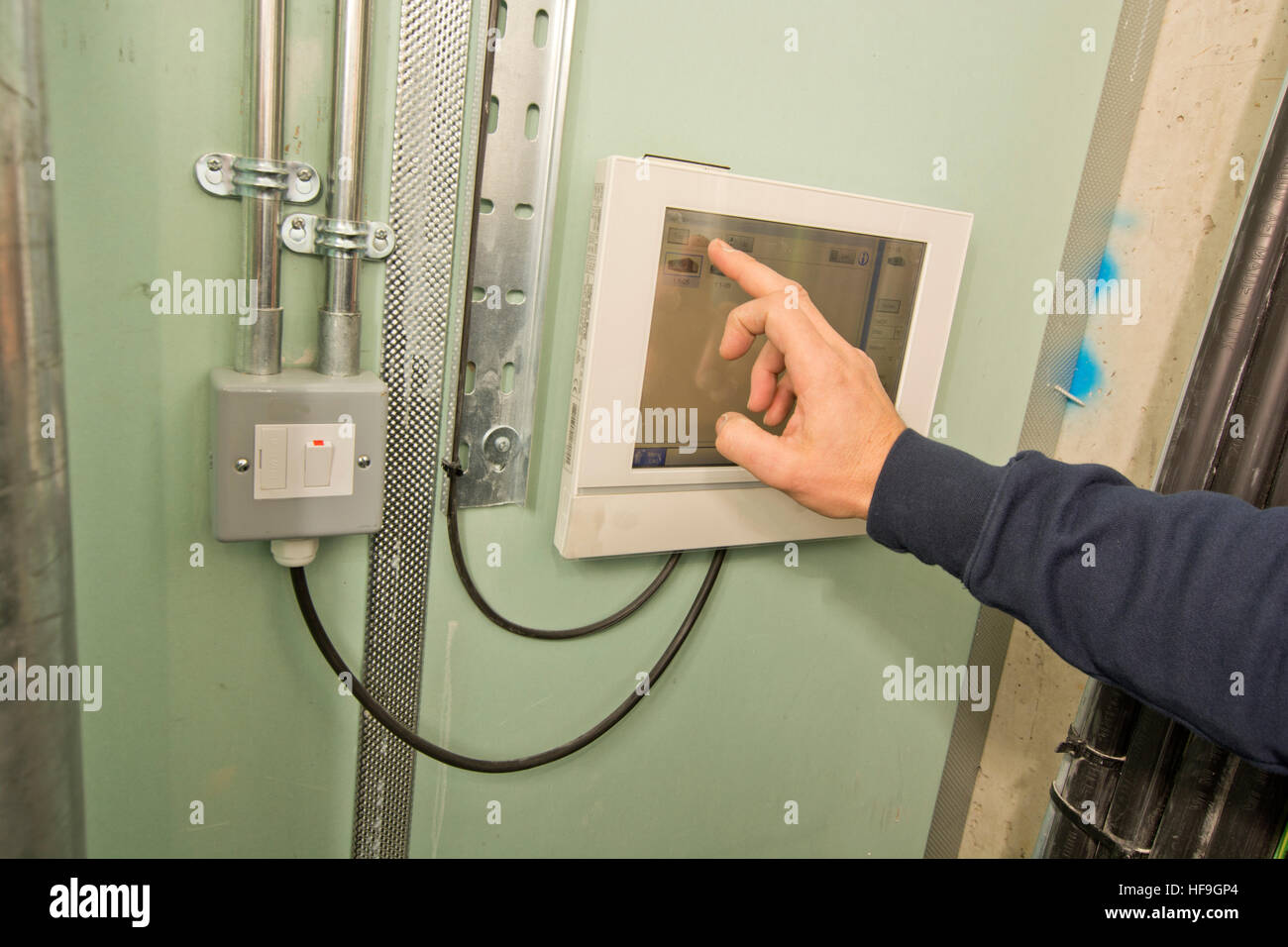 control panel operation in commercial office building Stock Photo