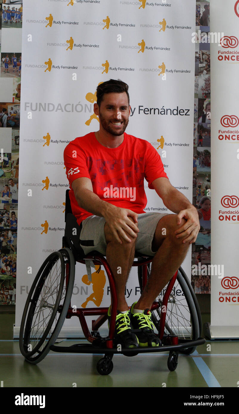 Spain basketball player, and former NBA, Rudy Fernandez gestures on a wheelchair during a charity. Stock Photo