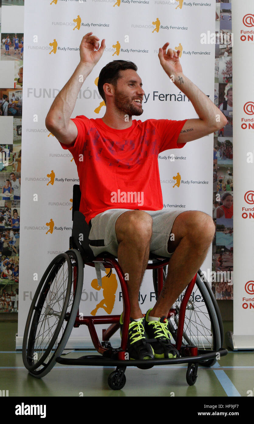 Spain basketball player, and former NBA, Rudy Fernandez gestures on a wheelchair during a charity. Stock Photo