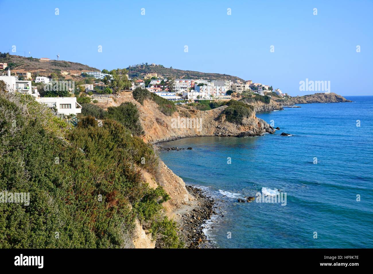 View along the rugged coastline with hotels and apartments to the rear, Bali, Crete, Greece, Europe. Stock Photo
