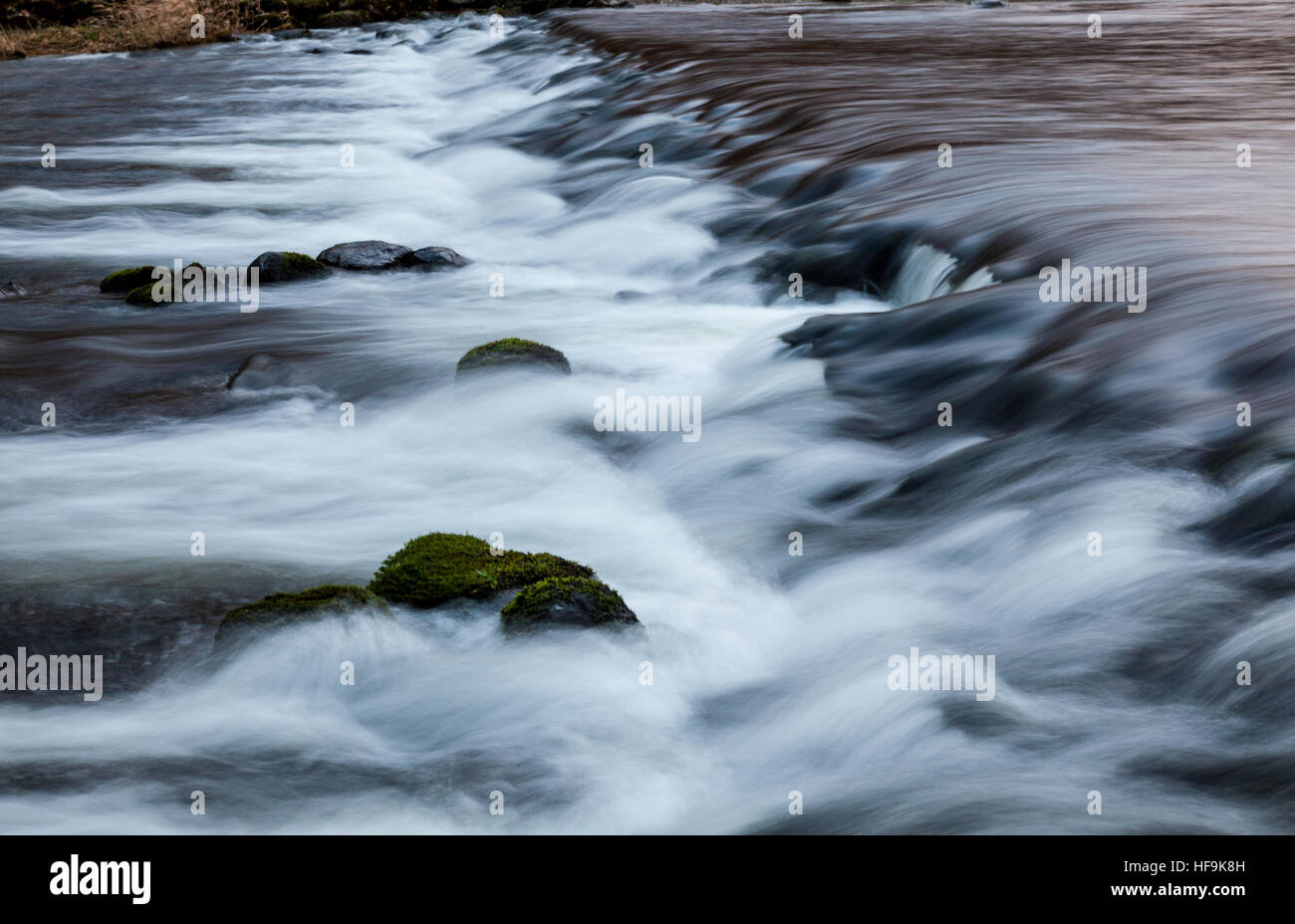 River Rothay dropping over the weir at Grasmere, Lake District, Cumbria Stock Photo