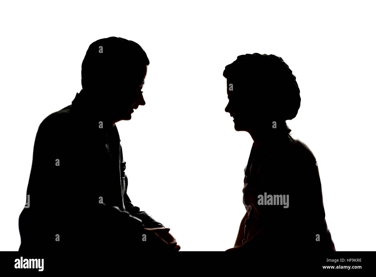 A silhouette of a senior elderly couple in conversation.model figurines. Stock Photo
