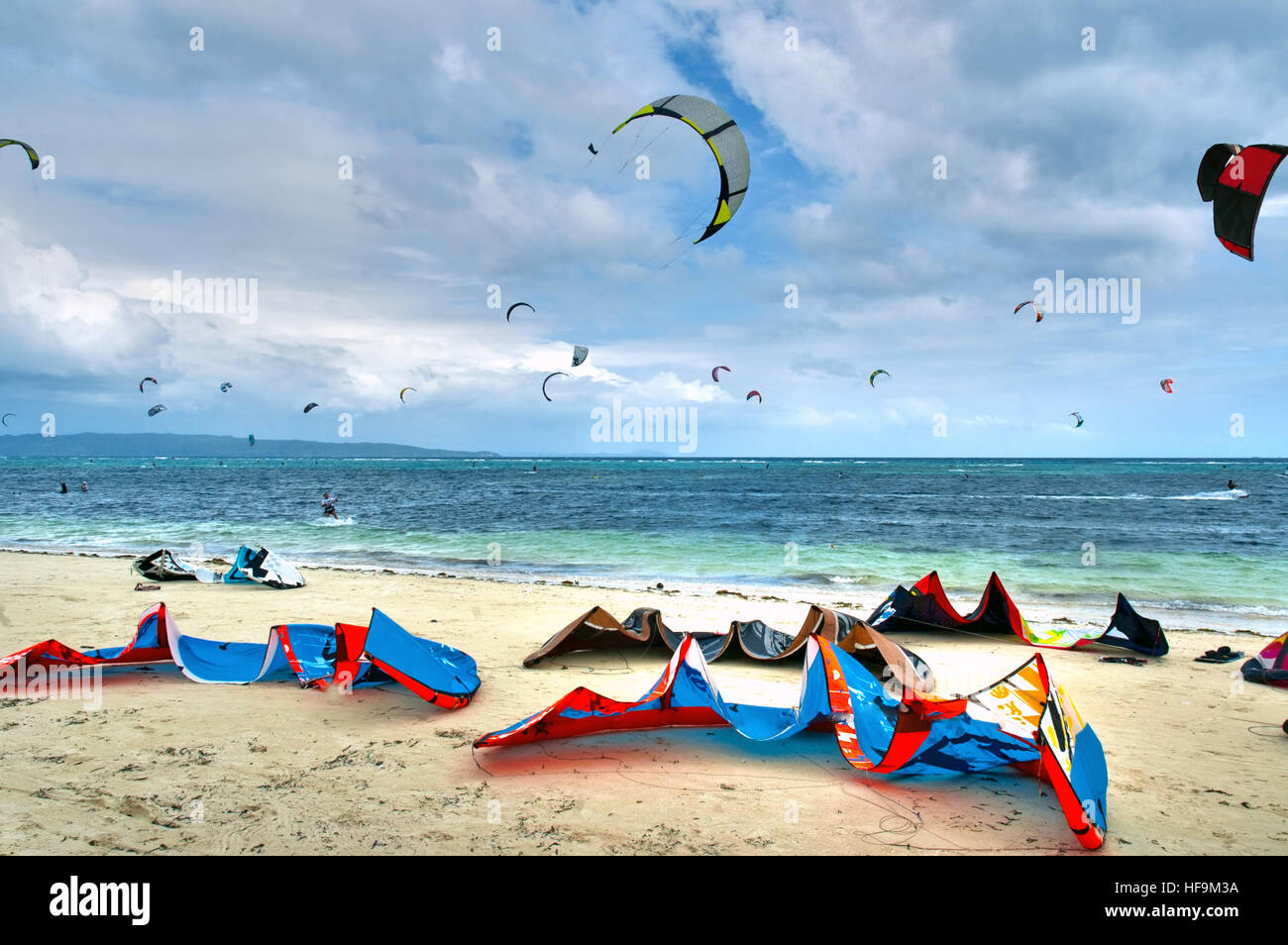 Colorful Kite surfing equipment laying  on a white sand beach in Boracay the Philippines Stock Photo